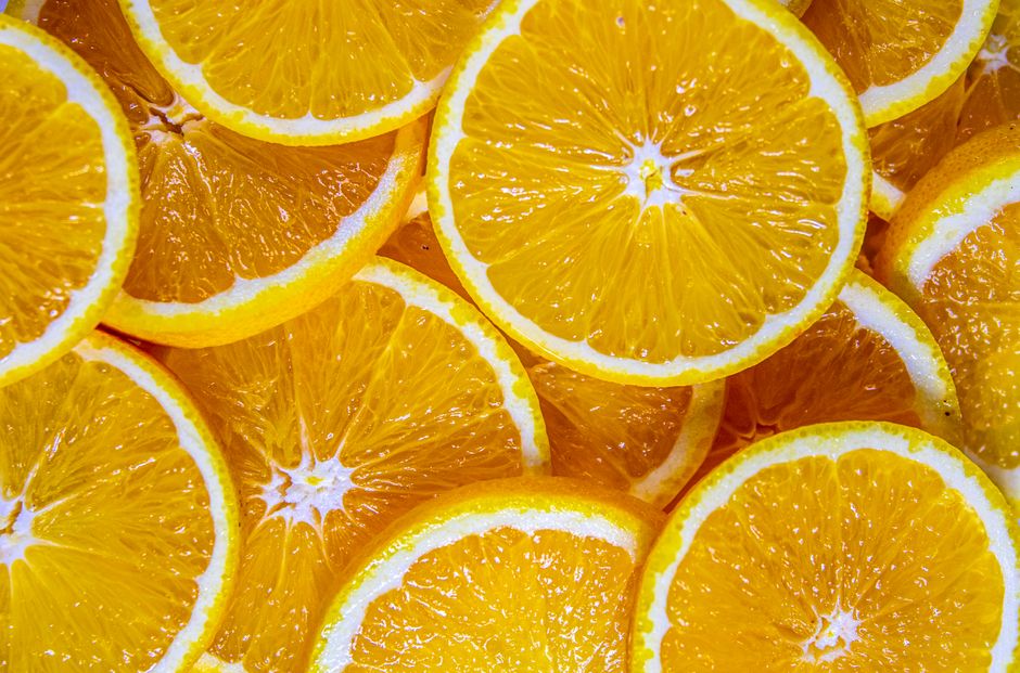 A close-up image showcasing fresh orange slices with vibrant colors and juicy textures.